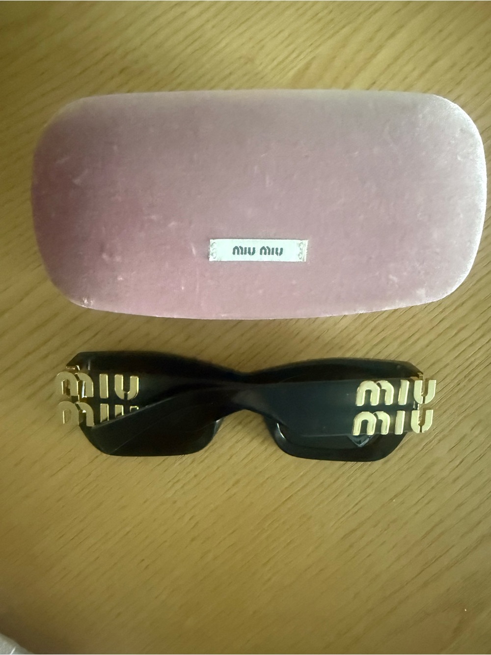 Miu Miu Black Sunglasses with Gold Logo Temples and Pink Velvet Case
